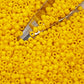 close up with beading scoop yellow beads