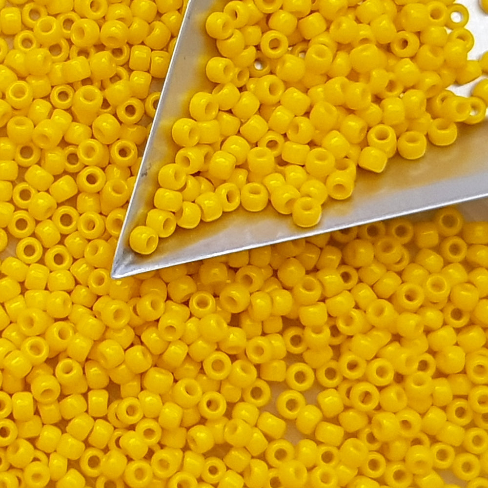 yellow beads with a triangle beading scoop
