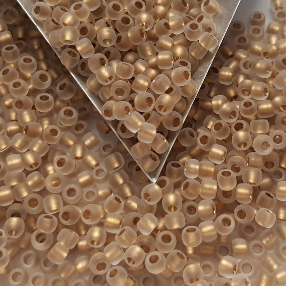 close up crystal frosted beads with a triangle scoop