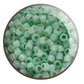 close up milky peridot beads circle