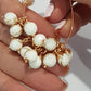 Single handmade 8 mm white howlite bead dangle showing gold-coloured wire wrap and open jump ring, SKU DBD-WP-WH-1pair