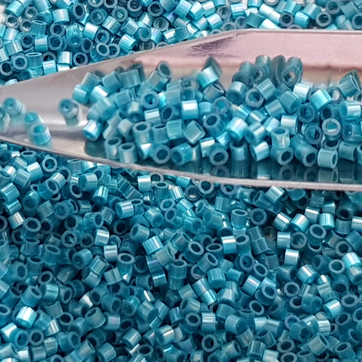 Aiko 11/0 TA-1573 Marine Blue Rainbow Fibre-Optic Iridescent Precision-Cut Cylinder Toho Seed Beads | Beading Supply