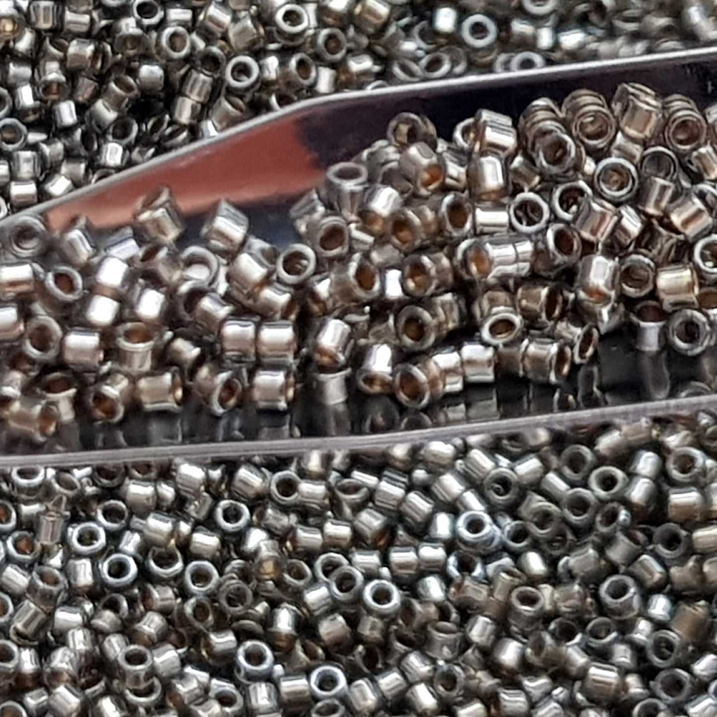 Aiko 11/0 TA-993 Black Diamond Gold-Lined Precision-Cut Cylinder Toho Seed Beads | Beading Supply