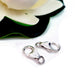 2 Sterling Silver 8mm Lobster Claw Clasp flower at the back on a white background