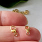 2 gold plated lobster claw clasps on a finger