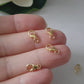 Short video of hand holding gold filled claw clasps.