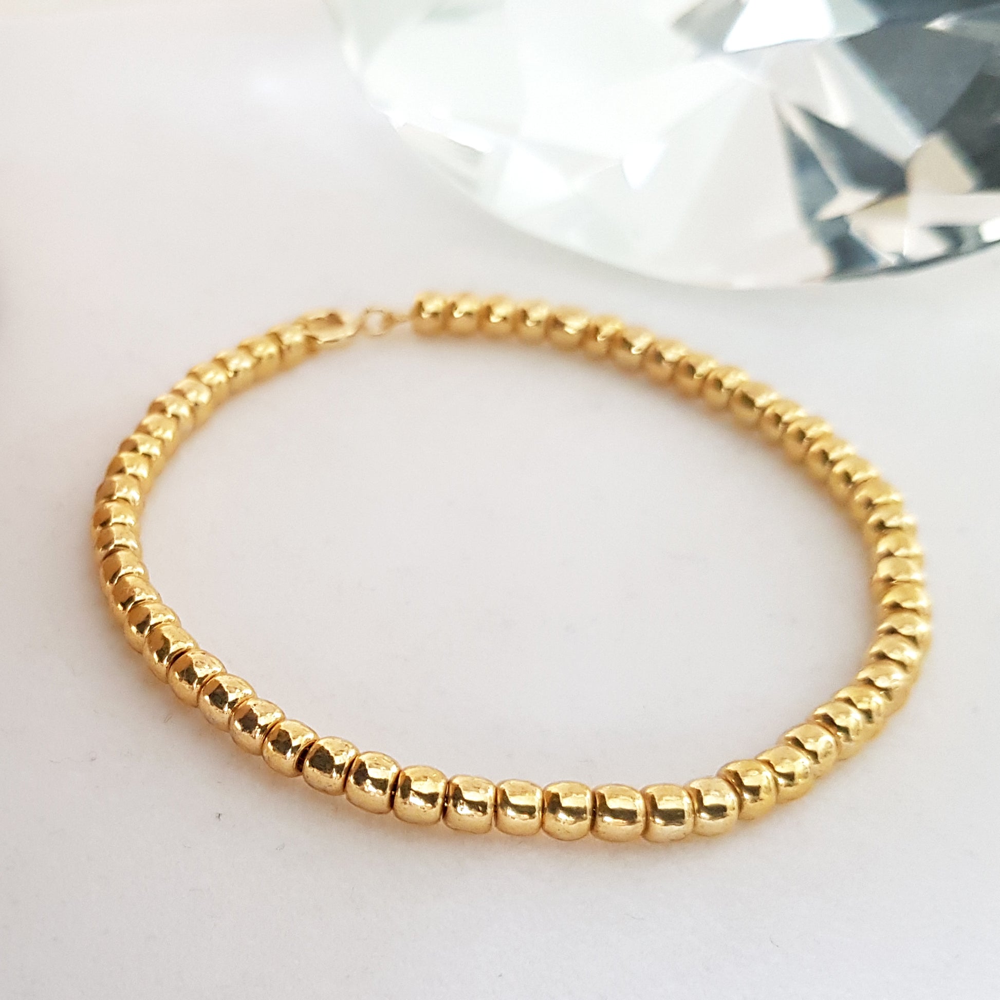 Gold beaded bracelet - white background - handmade  item
