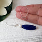 Showing medium kidney on a hand and also one with beads hanging, as a finished look