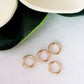 Jump Rings 5mm Closed Solid Yellow Gold on a white background,