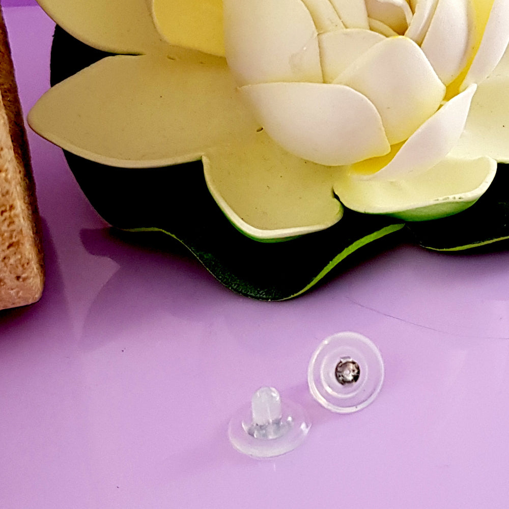 Silicone Large Butterflies Silver 925 Inserts | SS-009L | Jewellery Making Supply pink surface with white flower.