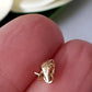 yellow gold 9ct pendant drop with a pearl cup between fingers showing the 375 stamp.