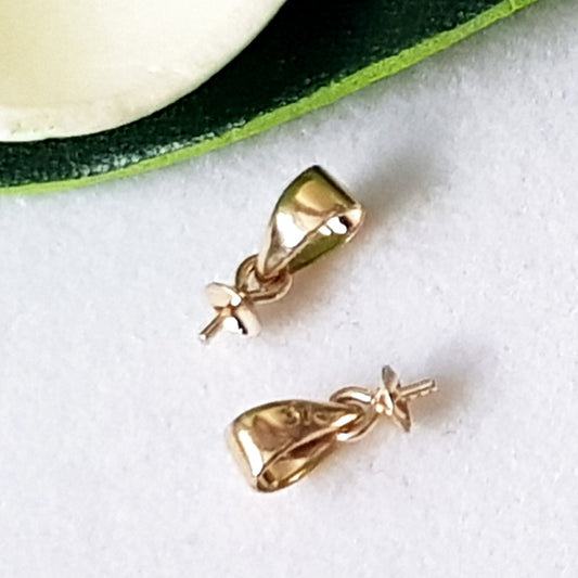 Two pearl pendant drops in 9ct yellow gold with bails, placed against a white background.