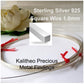 A coiled piece of sterling silver 925 square wire with red clips on the ends, labeled for jewellery making supply.