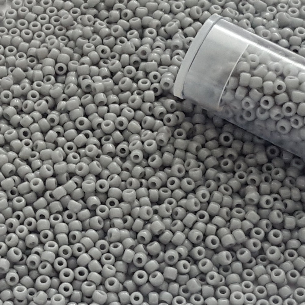 11/0 TR-53 Grey Opaque Round Toho Seed Beads - Beading Supply close up with a tube.