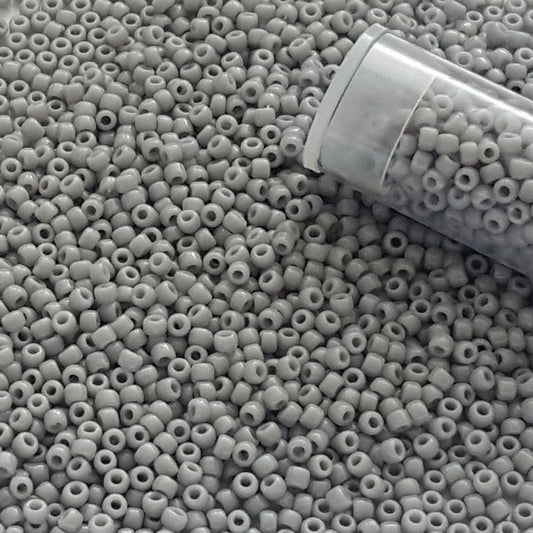 11/0 TR-53 Grey Opaque Round Toho Seed Beads - Beading Supply close up with a tube.