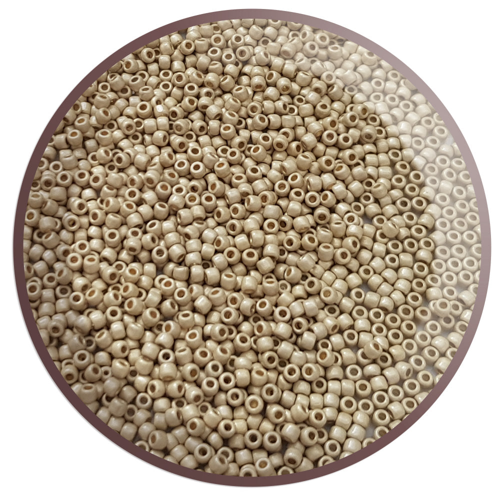 A pack of round, matte finish, aluminum galvanized Toho seed beads in a brown color.