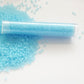 11/0 TR-143F Aqua Matte Ceylon Round Toho Seed Beads in a tube white background.