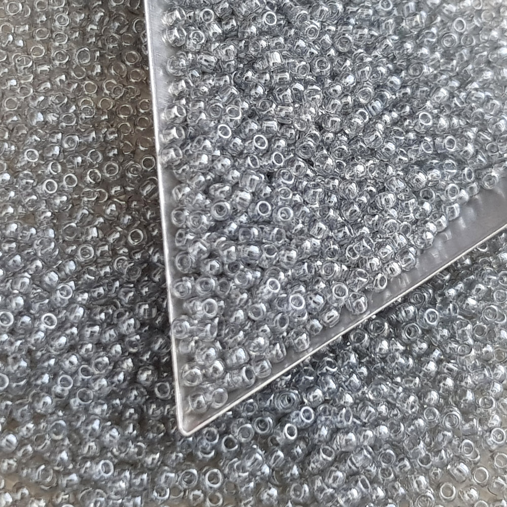black diamond transparent luster round Toho seed beads. 11/0 with triangle scoop.

