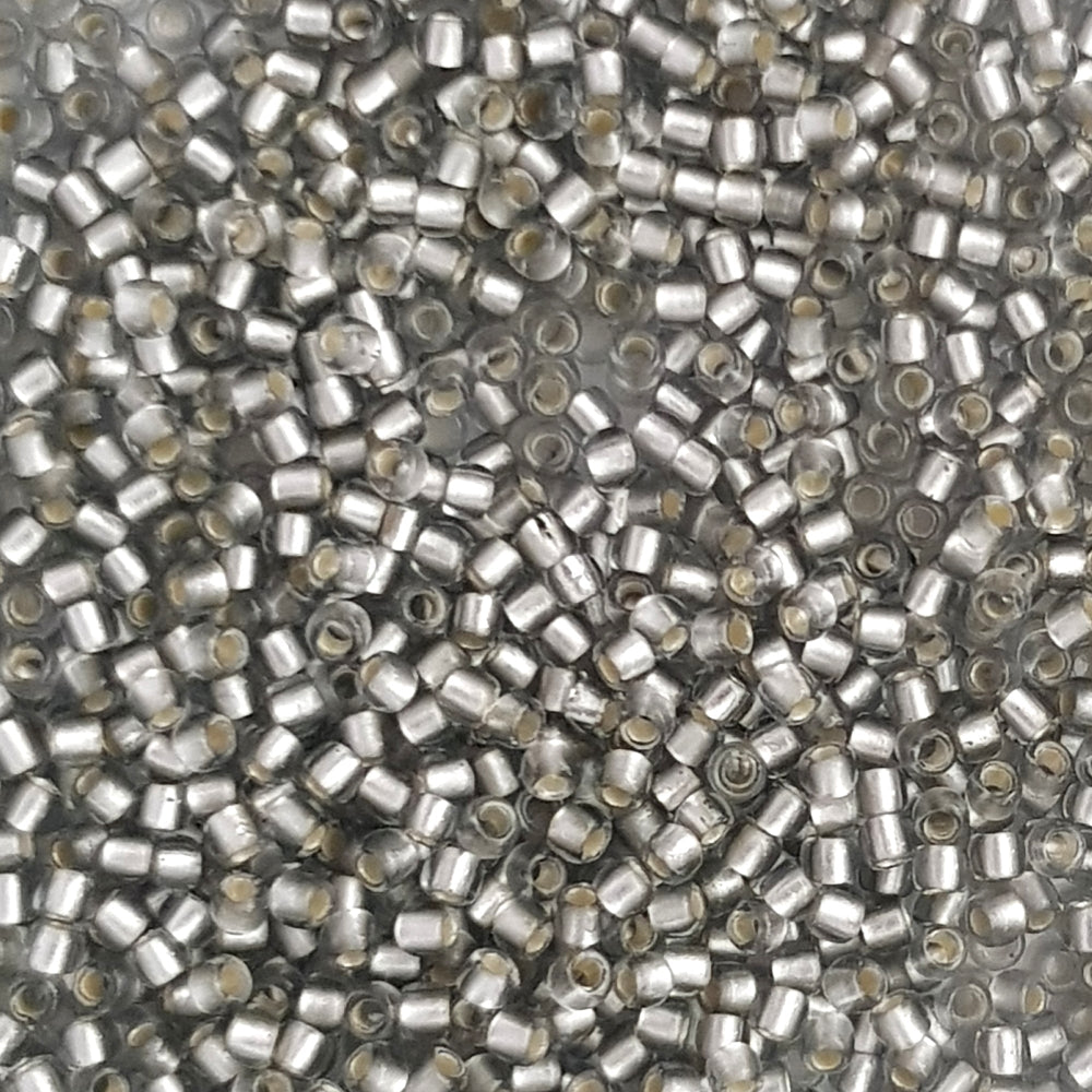 A collection of black diamond silver lined matte Toho round seed beads. 11/0 close up