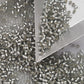 A collection of black diamond silver lined matte Toho round seed beads. 11/0 with triangle scoop