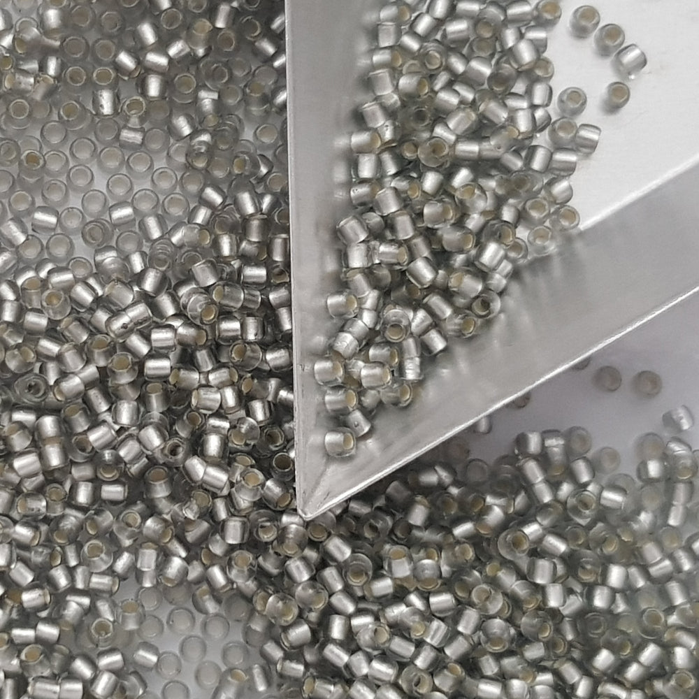 A collection of black diamond silver lined matte Toho round seed beads. 11/0 with triangle scoop