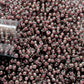 11/0 TR-367 Black Diamond Pink Lined Luster Round Toho Seed Beads Close up
