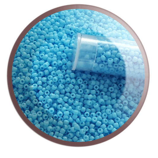 11/0 TR-43 Blue Turquoise Opaque Round Toho Seed Beads in a circle white background.