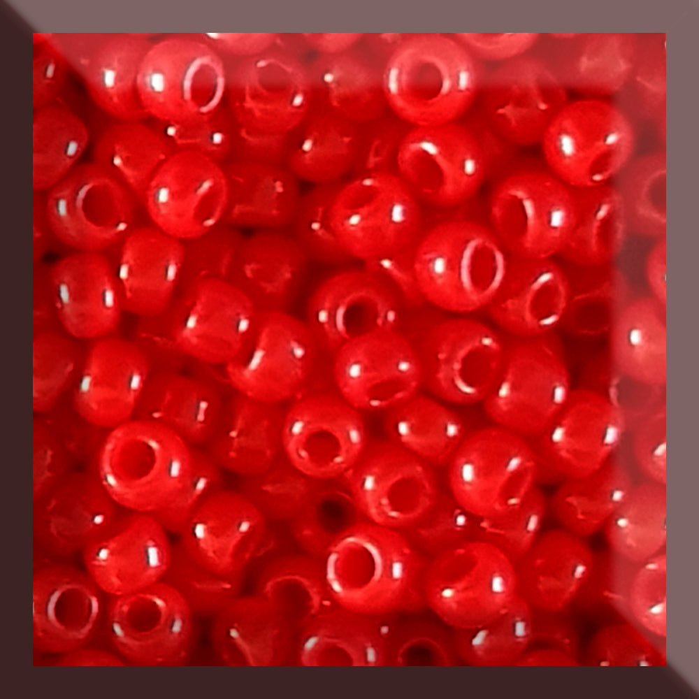 11/0 Toho Seed beads in cherry red opaque in a square window,