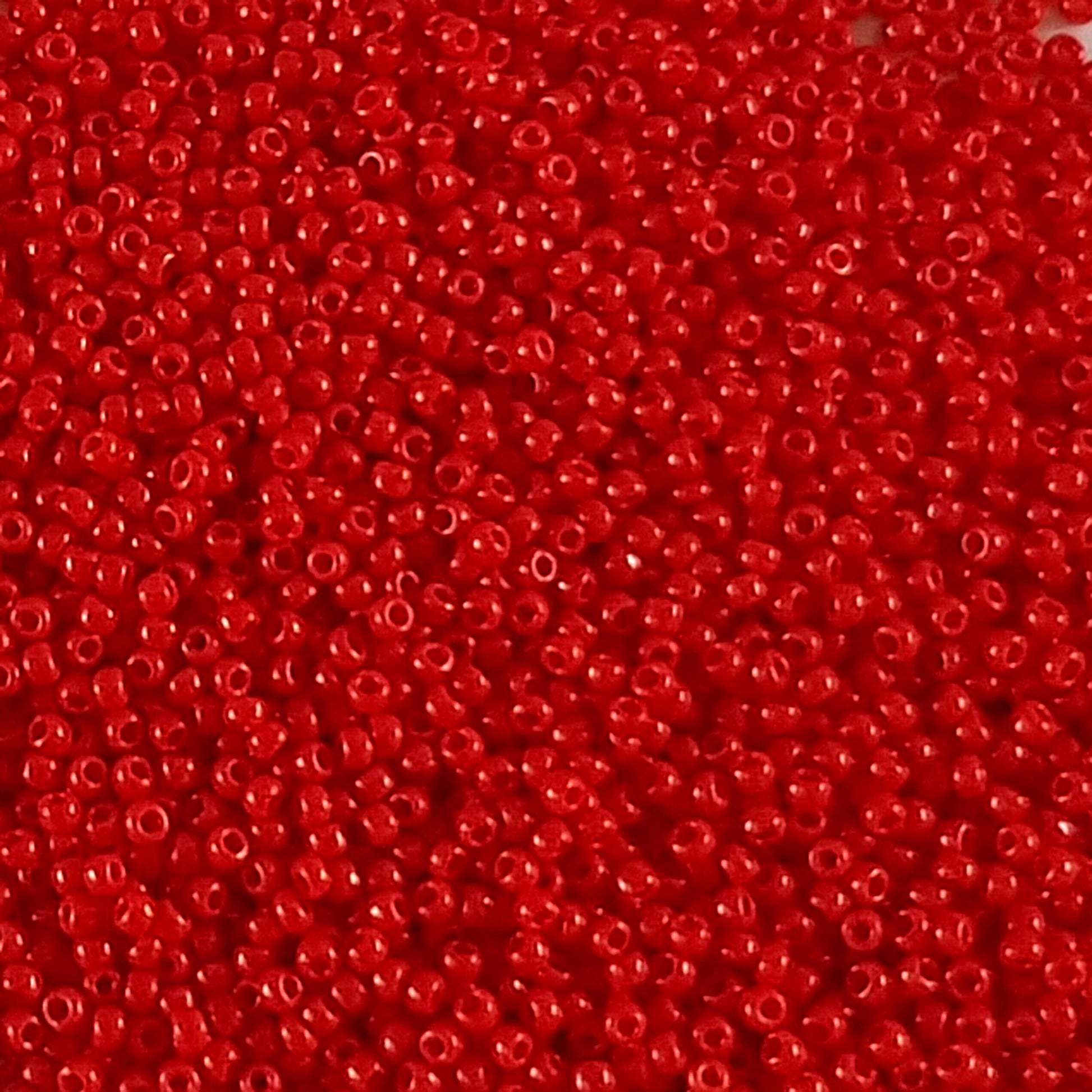 11/0 Toho seed beads in cherry red opaque TR-45A close up.