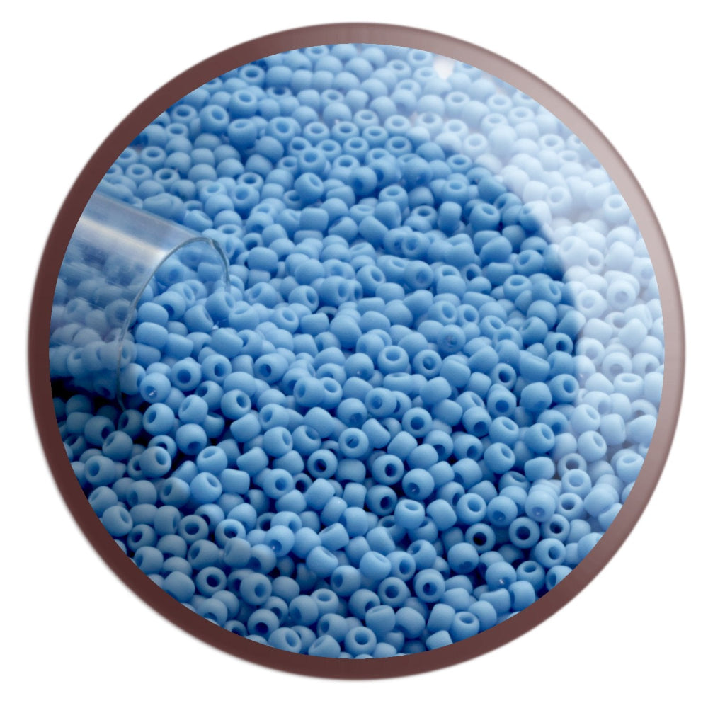 11/0 TR-43DF Cornflower Blue Opaque Matte Round Toho Seed Beads in a circle white background.