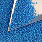 11/0 Toho seed beads in cornflower blue tr-43d with triangle scoop.