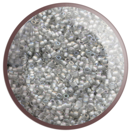11/0 TR-261 Crystal Rainbow Grey-Lined Round Toho Seed Beads - circle  white background.
