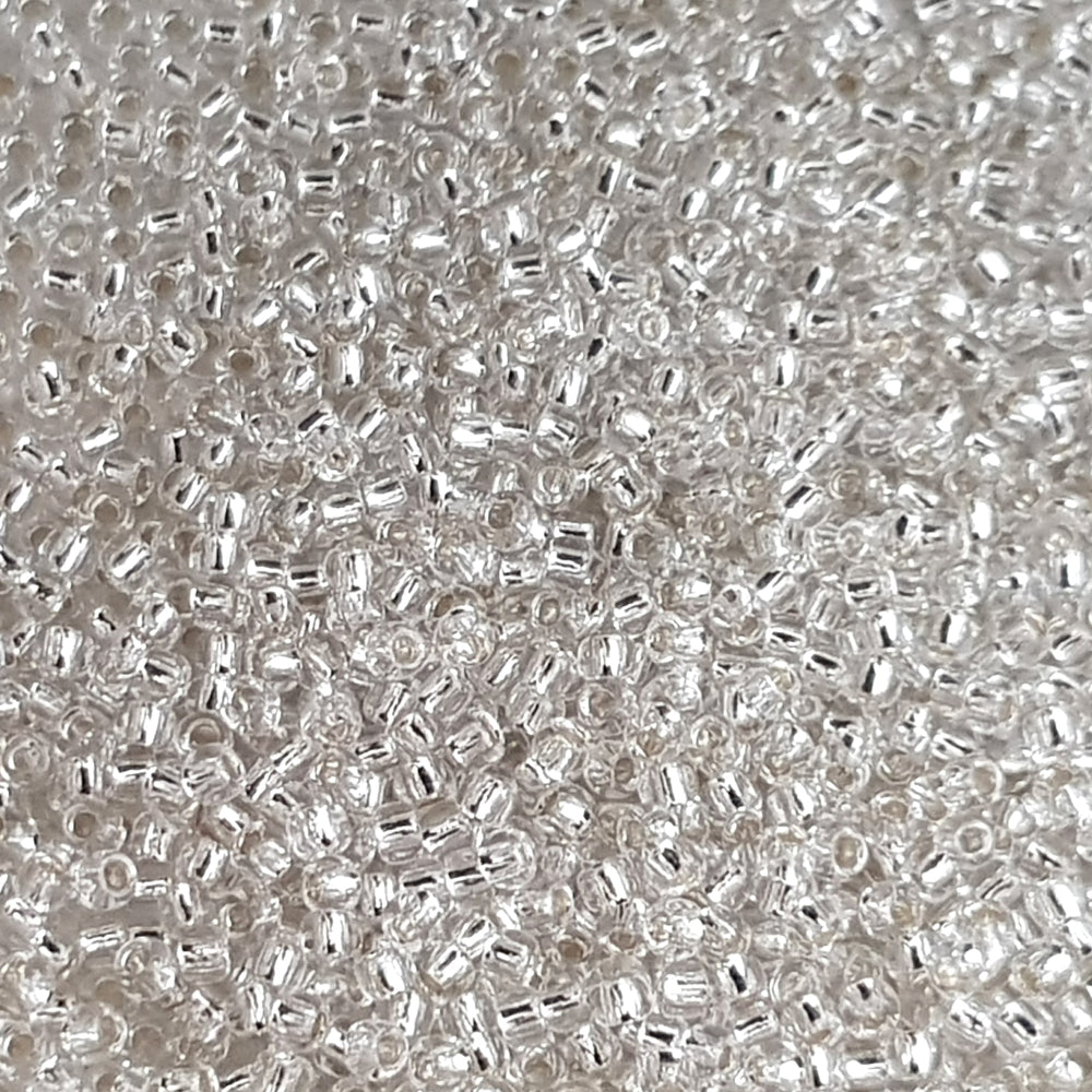 Toho 11/0 Crystal Silver-Lined TR-21 close up.