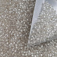 Toho 11/0 Crystal Silver-Lined TR-21 with a triangle scoop.