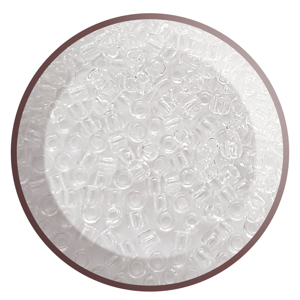 Toho 11/0  round, transparent, crystal-colored TR-1 in a circle.
