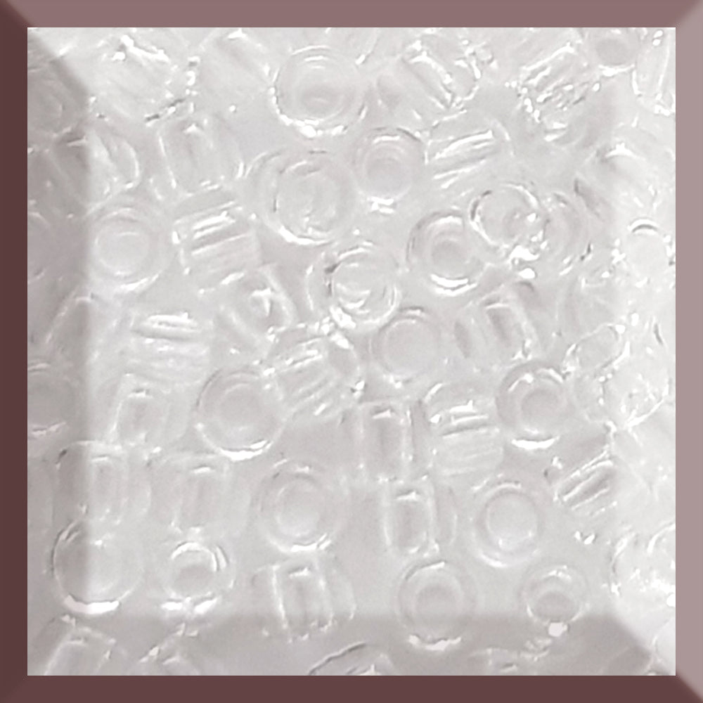 A close-up of transparent, round, crystal seed beads in a square window TR-1 11/0.
