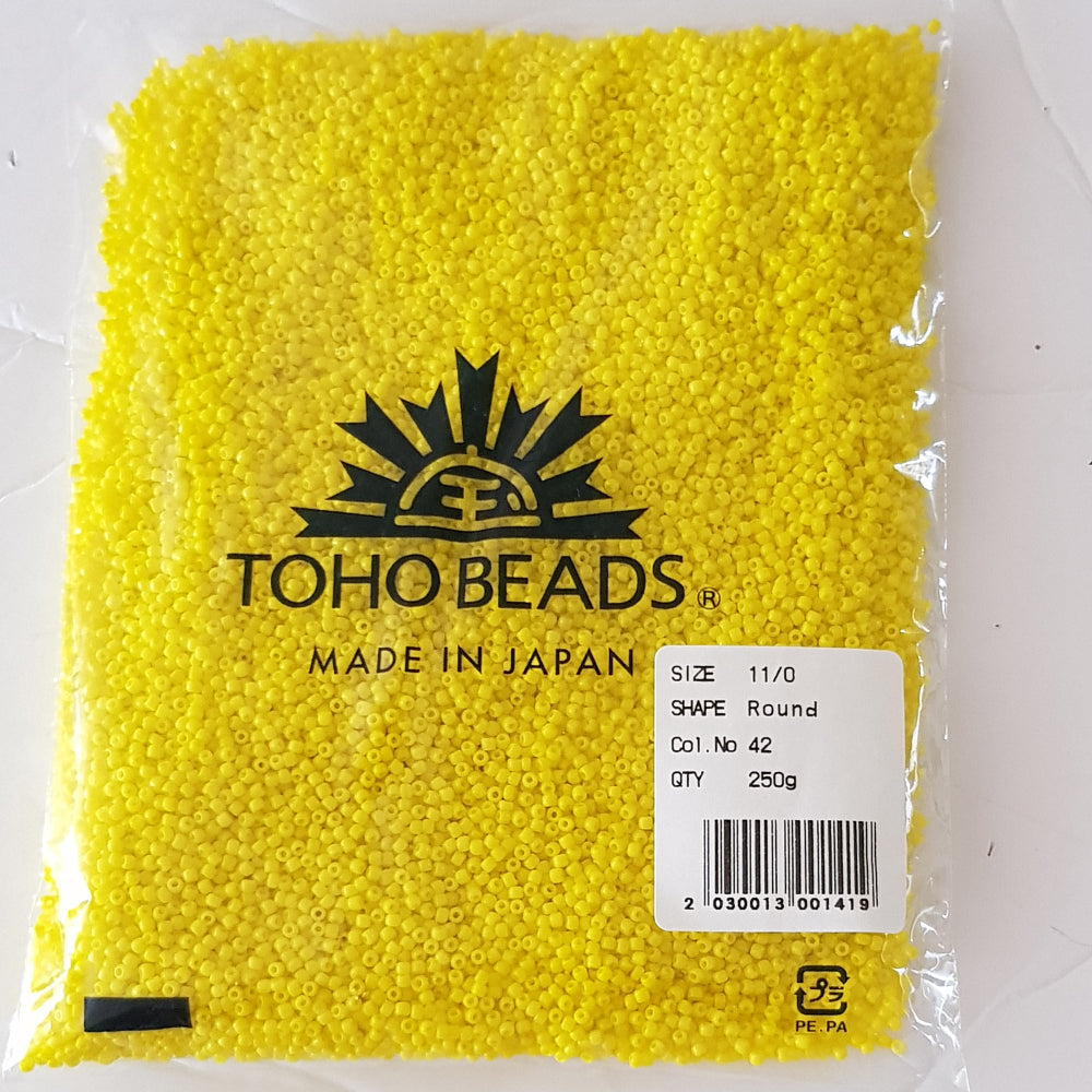 11/0 Toho seed beads dandelion yellow opaque in 250g pack.
