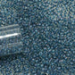 11/0 TR-193 Crystal Lustre Dark Capri Lined Round Toho Seed Beads close up.