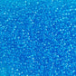 11/0 Toho seed beads in dark aquamarine transparent close up.