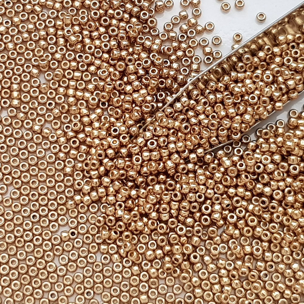 11/0 Toho Seed Beads in Golden Fleece Permanent Finish TR-PF592 with beading scoop.