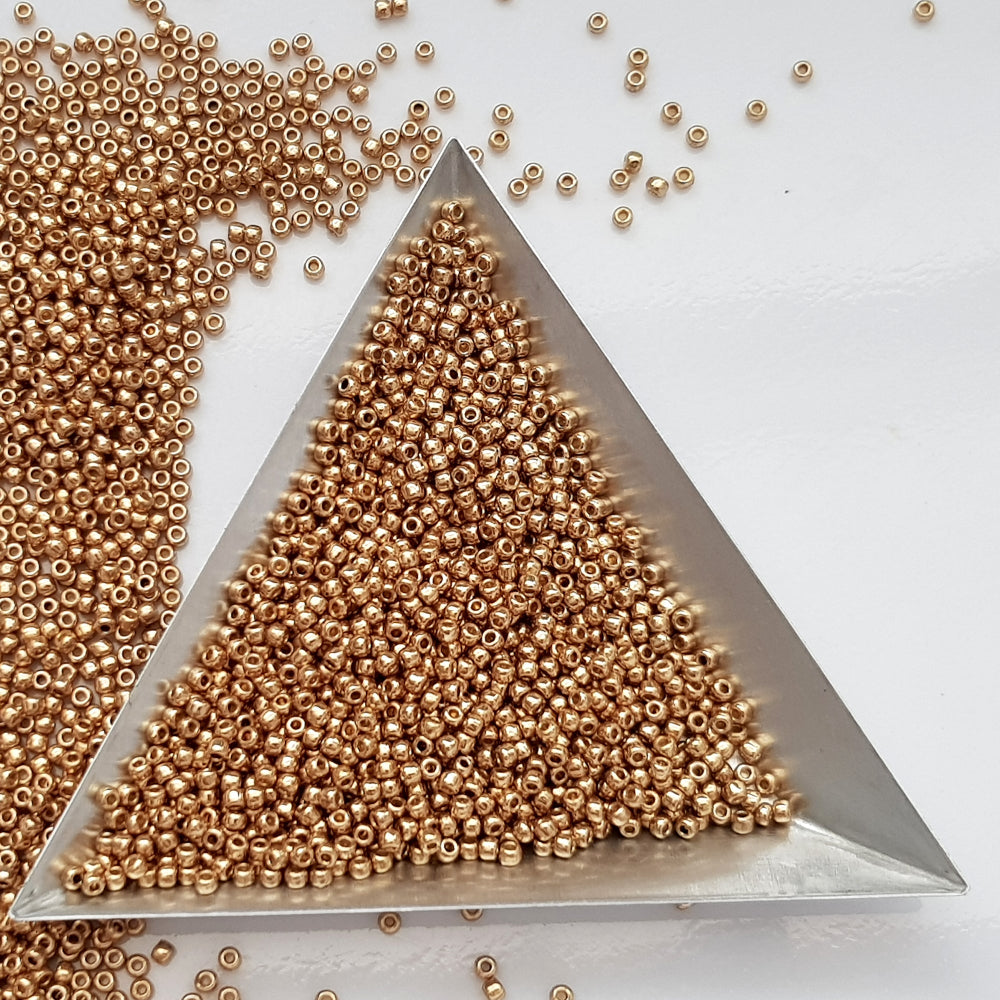 11/0 Toho Seed Beads in Golden Fleece Permanent Finish TR-PF592 with a triangle scoop.