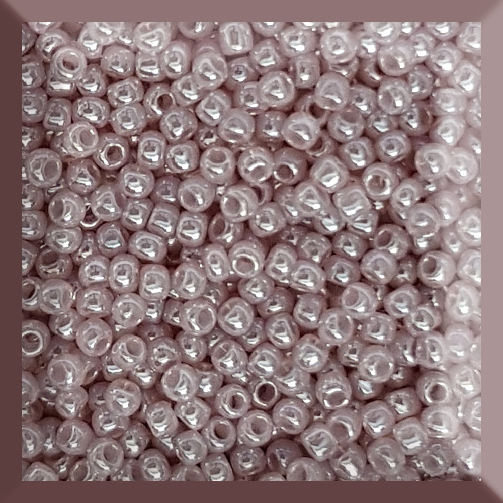 round Toho seed beads in Grape Mist Ceylon colour 11/0 in a square window.
