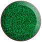 11/0 Toho Seed Beads in grass green frosted transparent TR-7BF in a circle white background.