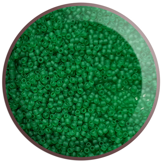 11/0 Toho Seed Beads in grass green frosted transparent TR-7BF in a circle white background.