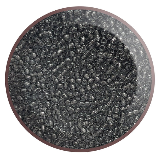 11/0 Toho seed beads in grey transparent TR-9B in a circle white background.