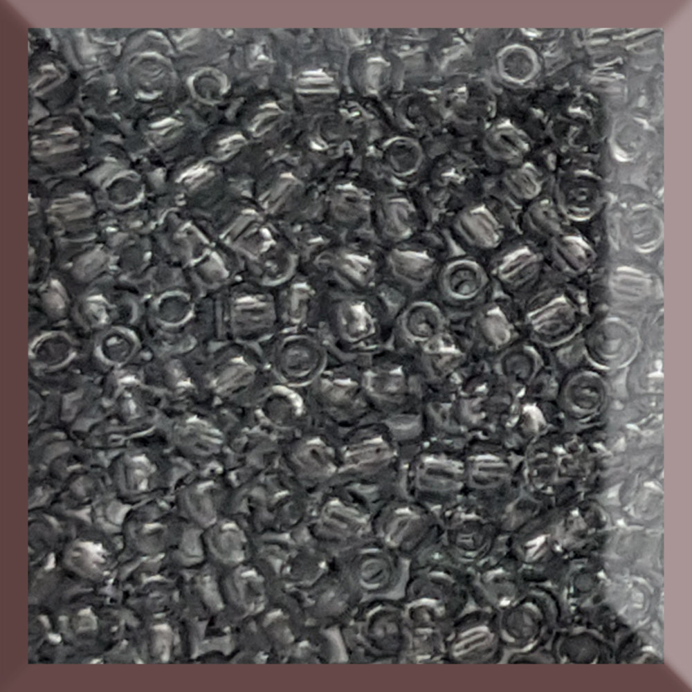 11/0 Toho Seed Beads in grey transparent in a square window.