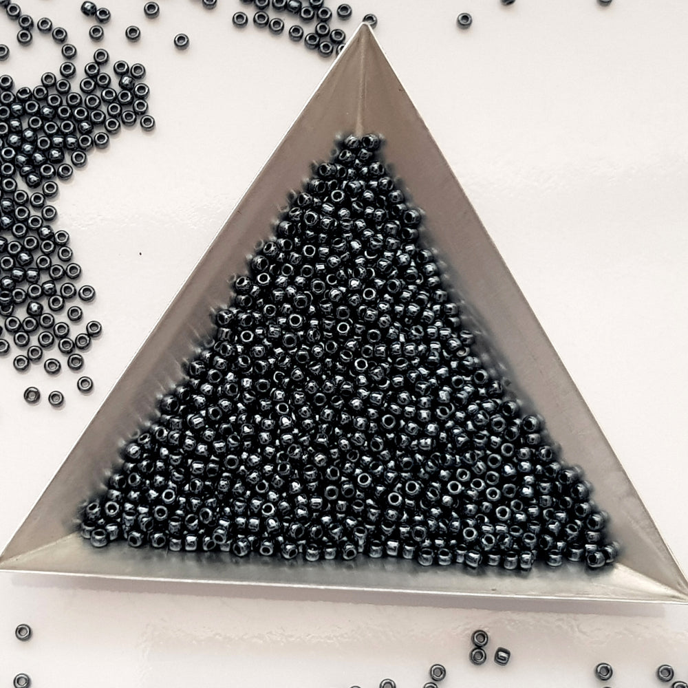 11/0 Toho seed Beads in haematite metallic TR-81 with triangle scoop.