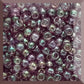 A close-up view of Hydrangea Gold Luster Round Toho Seed Beads 11/0 showing their lustrous finish and multicolored appearance. square window