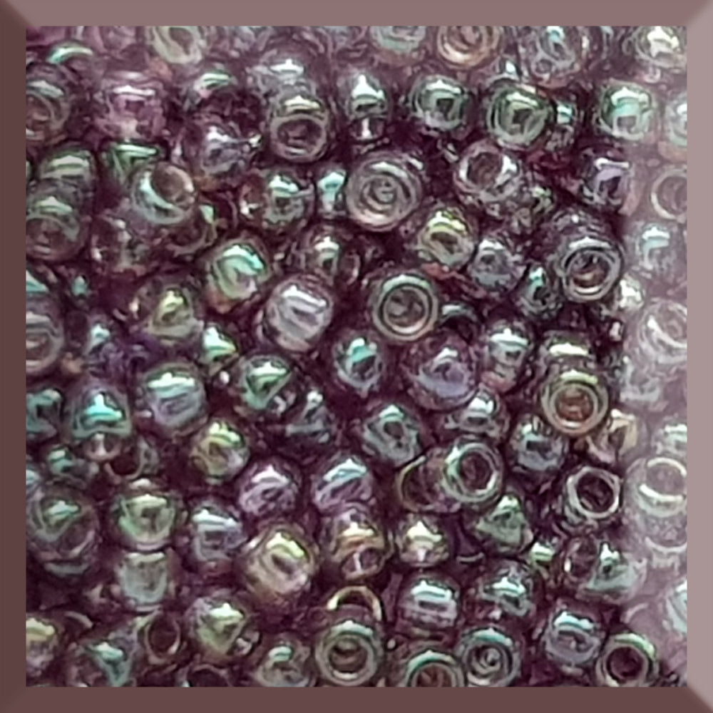 A close-up view of Hydrangea Gold Luster Round Toho Seed Beads 11/0 showing their lustrous finish and multicolored appearance. square window