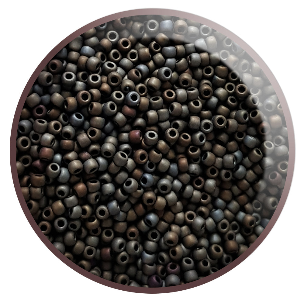 11/0 Toho Seed Beads in Iris Brown Metallic Frosted TR-83F in a circle white background.